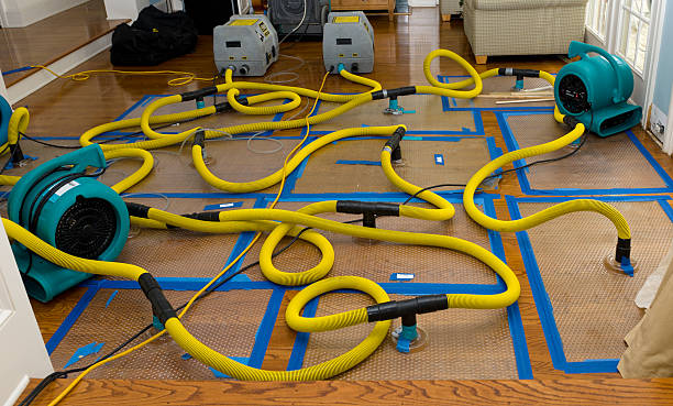 Professional Flood Damage Restoration technician working in Sanger, CA